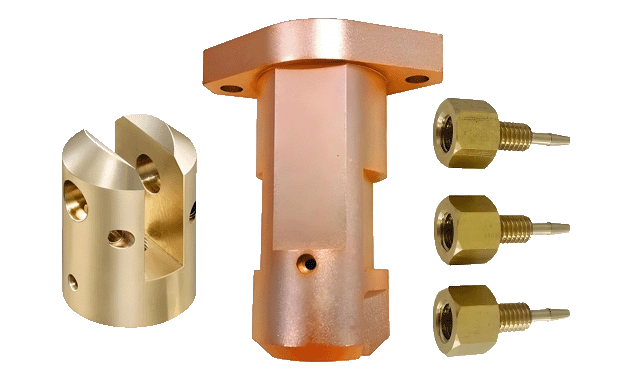 Brass-coloured pipes, fittings and threaded parts, titled as copper alloy material on the source page.
